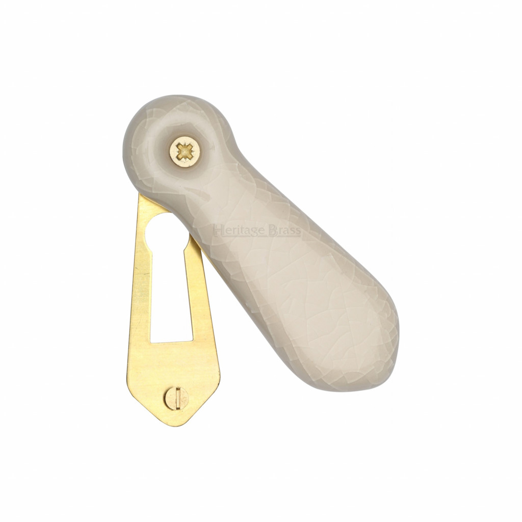 M Marcus Heritage Brass Cream Porcelain Covered Escutcheon
